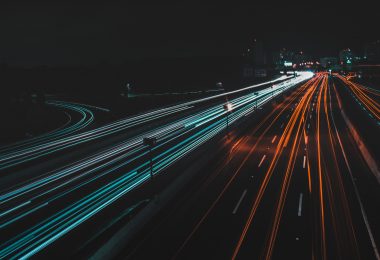 Long exposure of traffic on a highway with headlights and taillights blurred.