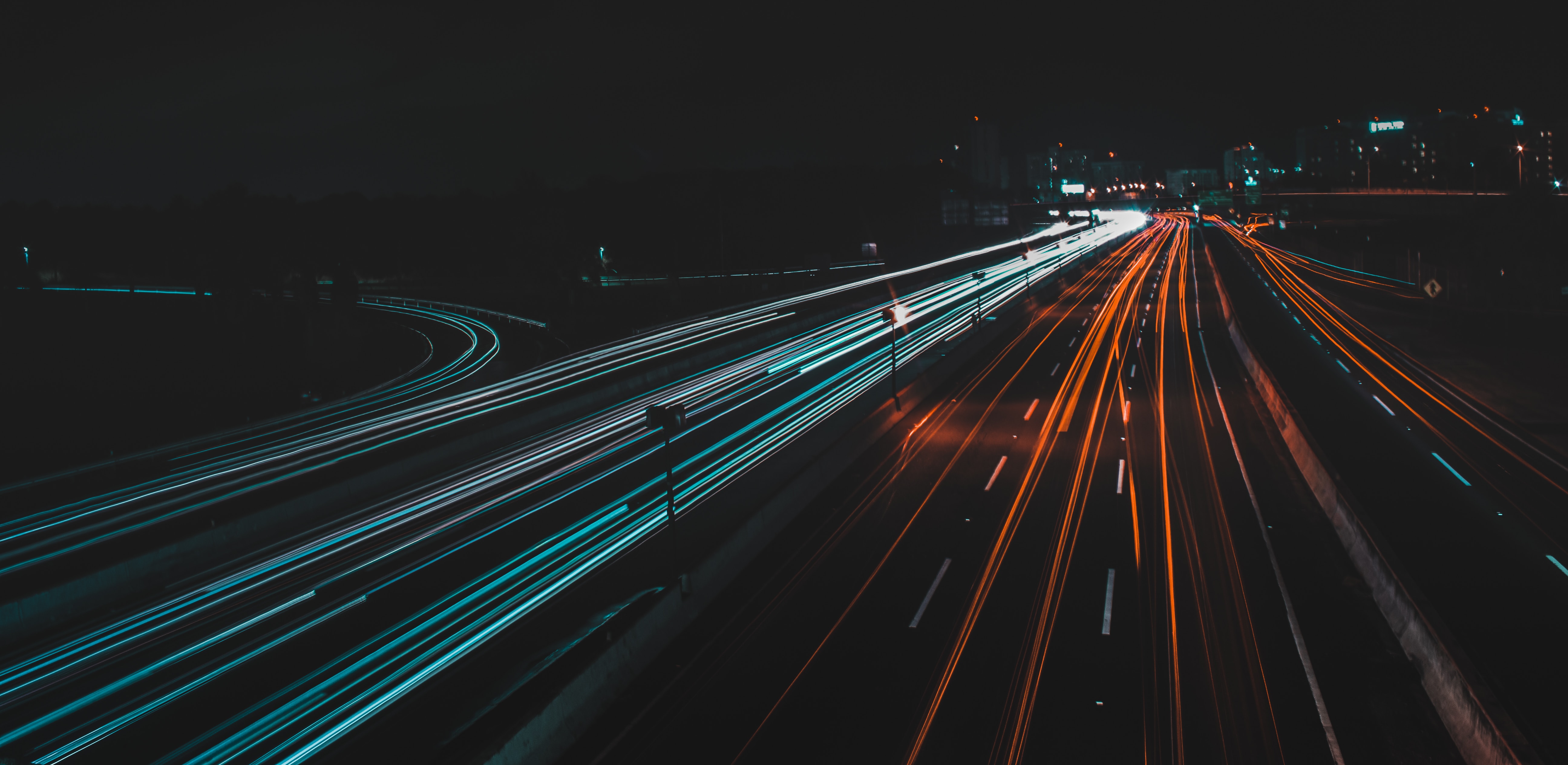 Long exposure of traffic on a highway with headlights and taillights blurred.